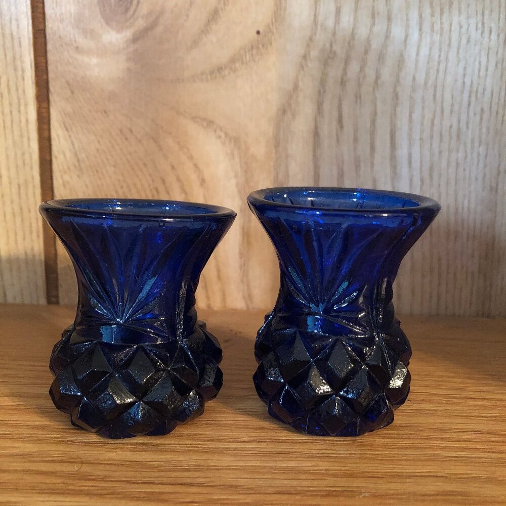 Two cobalt blue vintage toothpic holders. 2" and 2 1/4' tall. 1 7/8' diameter.